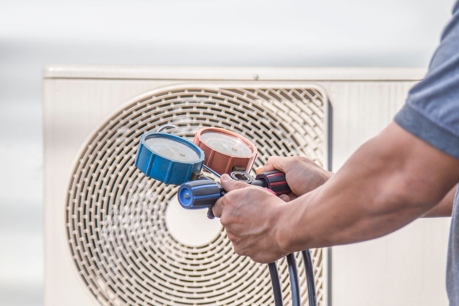 air conditioning hvac service technician using gauges check refrigerant add refrigerant scaled